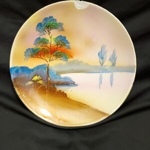 Hand-Painted Ceramic Wall Plate with Blue, Orange and Brown Landscape